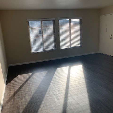 A room with a window and a door.